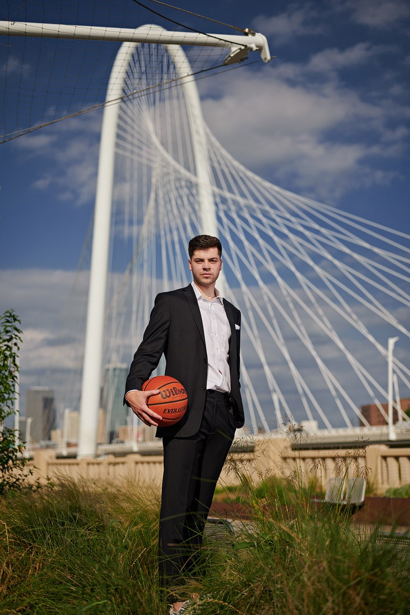 Bishop Lynch Senior Portraits with the Kirk bridge in the background in dallas texas